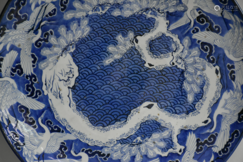 Large Japanese porcelain dish decorated with swans.