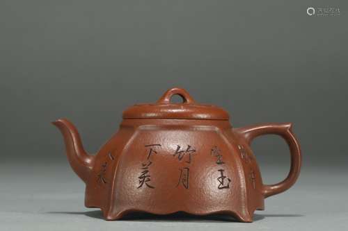 A Chinese Zisha Teapot With Potery Pattern