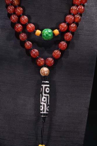 A Chinese Agate 9-Eye Dzi Necklace