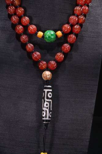 A Chinese Agate 9-Eye Dzi Necklace