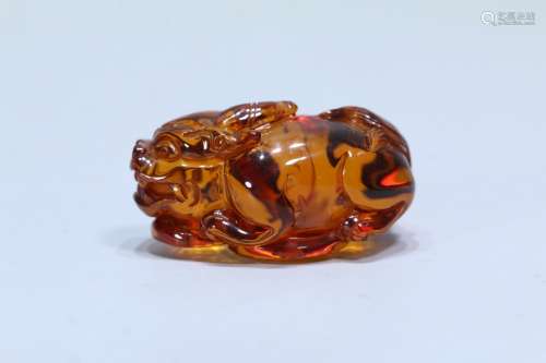 A Chinese Amber Beast Carved Ornament