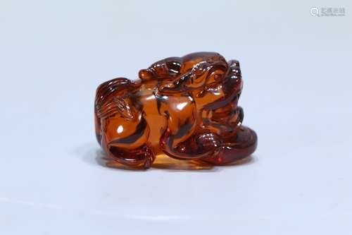 A Chinese Amber Beast Carved Ornament