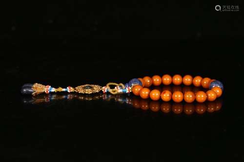 A Chinese Amber Pendant With 18 Beads