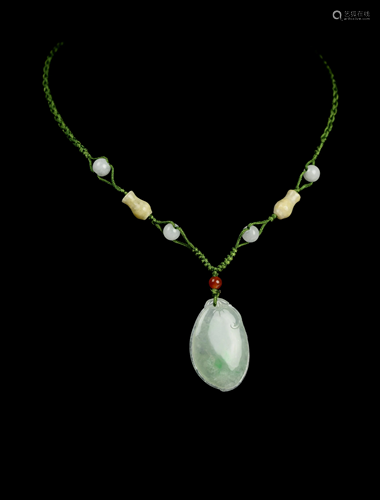 [Chinese] A Jadeite Melon Shape Pendant wit…