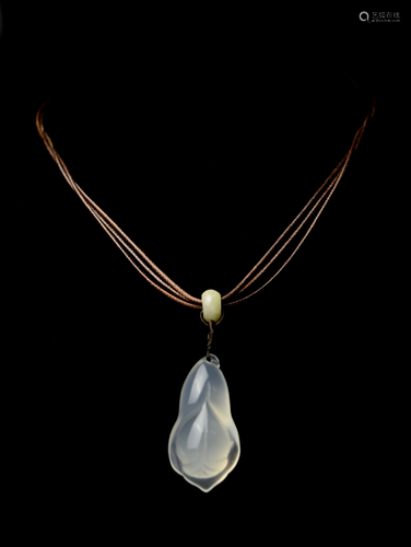 A Finely Carved White Chalcedony Pendan…