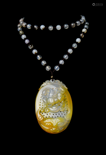 A Exquisitely Carved Hollow out Agate Pendant…