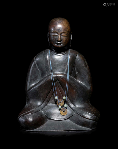 A Chinese Bronze Figure of a Monk