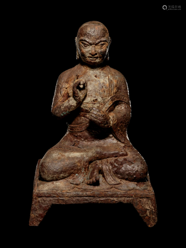 A Tibetan Cast Iron Figure of a Monk