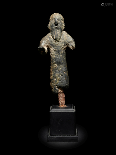 A Near Eastern Bronze Figure of a Man H…