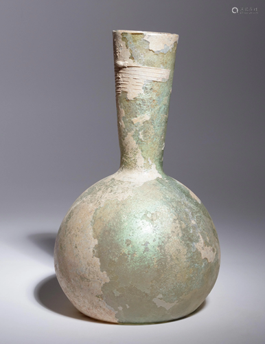 A Roman Glass Bottle Height 8 7/8 inches.