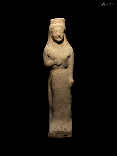 A Greek Terracotta Kore Height 9 1/2 inches.