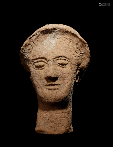 A Greek Terracotta Head Height 10 inches.