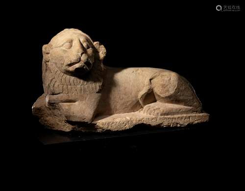 An Egyptian Limestone Recumbent Lion …