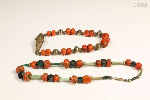 Tibet, a necklace of coral and silver alloy beads,…