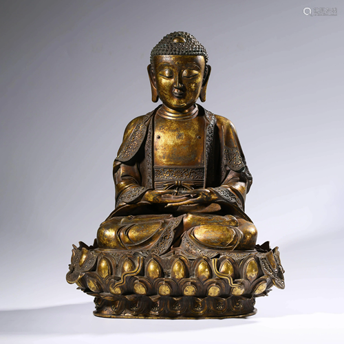 A GILT BRONZE SAKYAMUNI