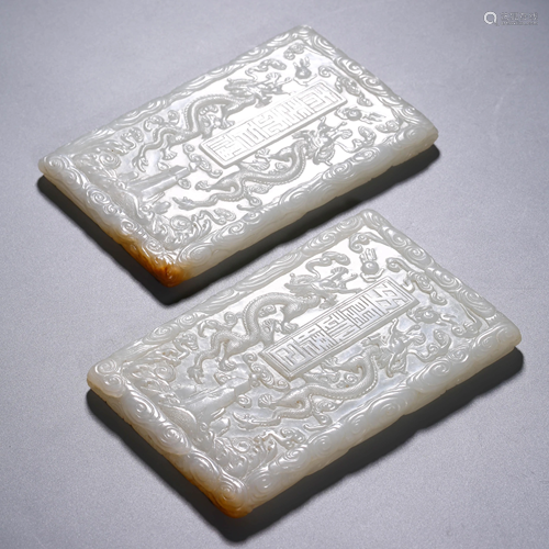 A PAIR OF WHITE JADE PENDANT