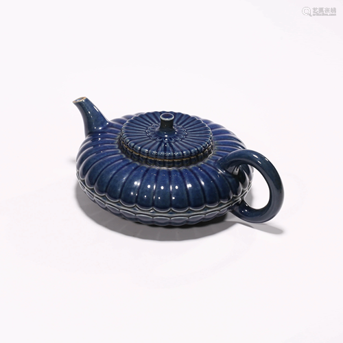 A BLUE-GLAZED FLORIFORM TEAPOT