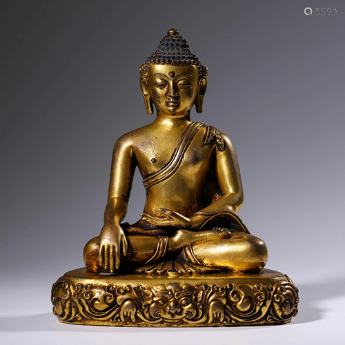 A GILT BRONZE SAKYAMUNI