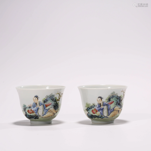 A PAIR OF FAMILLE ROSE FIGURE CUPS WITH…