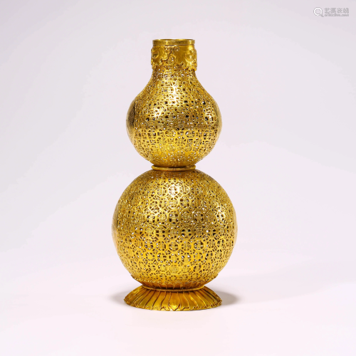 A GOLD DOUBLE-GOURD VASE WITH GUA…