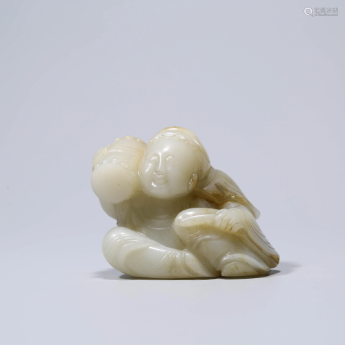 A WHITE JADE CHILD PLAYING THE DRU…