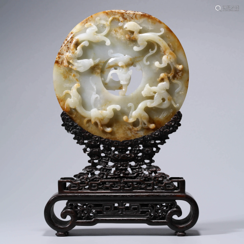A WHITE JADE CHI DRAGON CARVED TABLE …