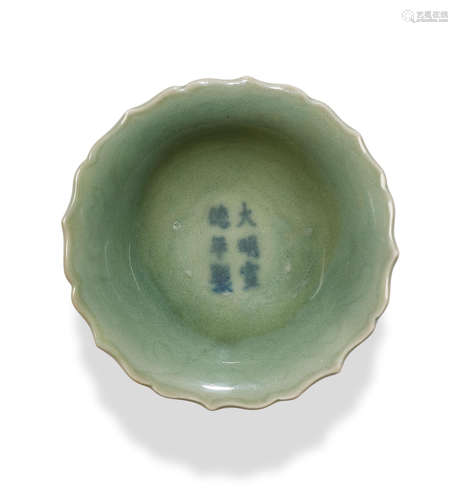 A small celadon-glazed incised dish Xuande six-character mark and of the period