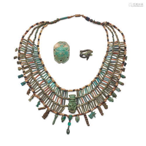 An Egyptian glazed composition bead collar together with two Egyptian amulets, 5