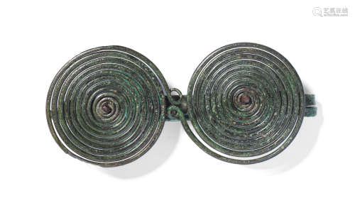 A European bronze spectacle fibula