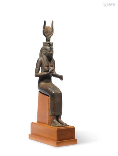 A large Egyptian bronze figure of Isis