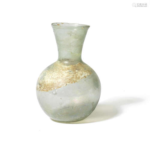 A Roman pale green glass flask