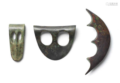 Two Near Eastern bronze axe heads and a Near Eastern bronze attachment 3