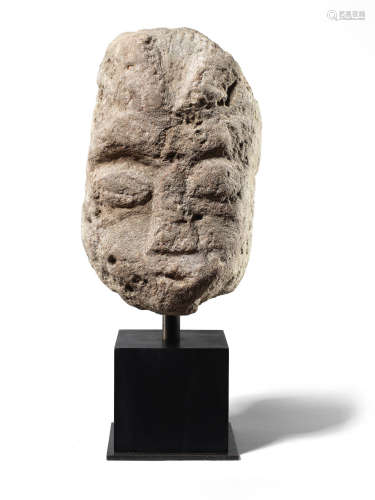 A Celtic limestone head of a deity, probably Cernunnos
