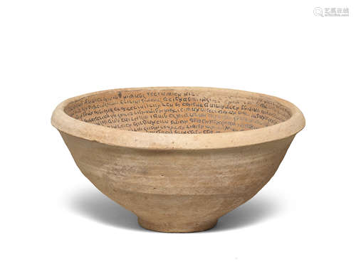 A large Mesopotamian pottery incantation bowl