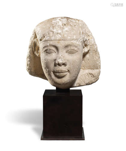 An Egyptian limestone head of a pharaoh