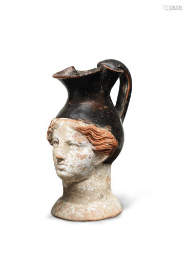A Greek pottery figural oinochoe