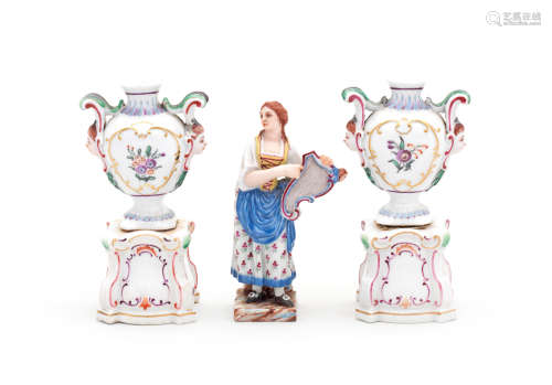 A pair of Doccia miniature vases on pedestals and a small Doccia figure of a girl, circa 1790-1800