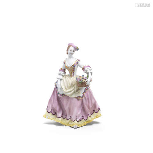 A Vienna figure of a woman with flower basket, circa 1744-49