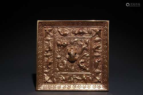 A Chinese Gilt Bronze Beast And Grape Mirror