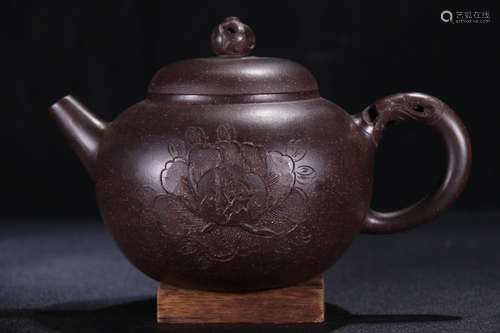 A Chinese Zisha Teapot With Plum Blossom Pattern