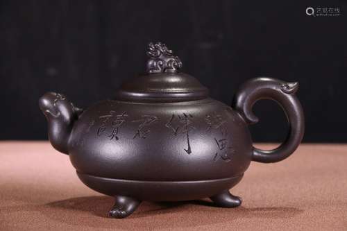 A Chinese Zisha Teapot With Beast Carving