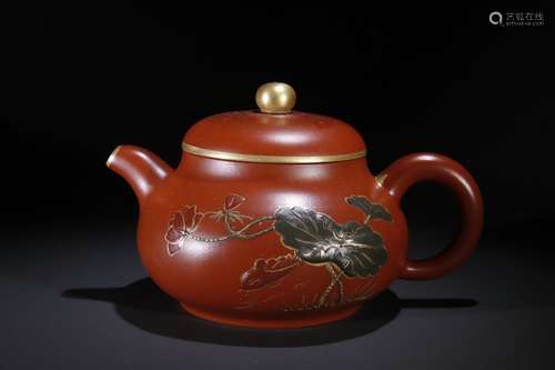 A Chinese Zisha Teapot With Lotus Pattern And Golden Painting