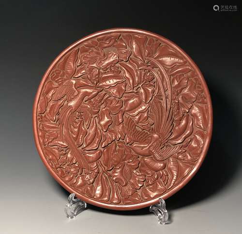 A CARVED RED LACQUER PLATE, INSCRIBED ON BASE