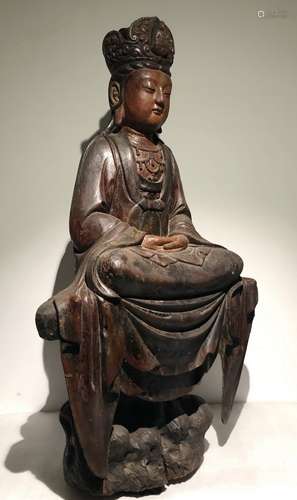 A WOODEN FIGURE OF GUANYIN