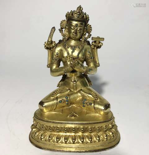 A GILT-BRONZE FIGURE OF MANJUSHRI