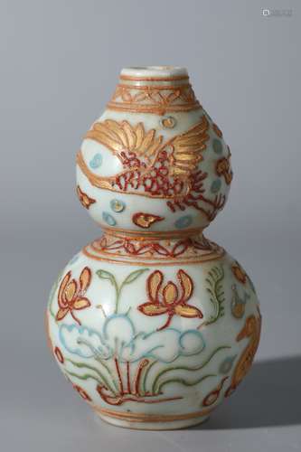 A Chinese Gilt-Decorated Figure of Floral and Phoenix Courd Vase