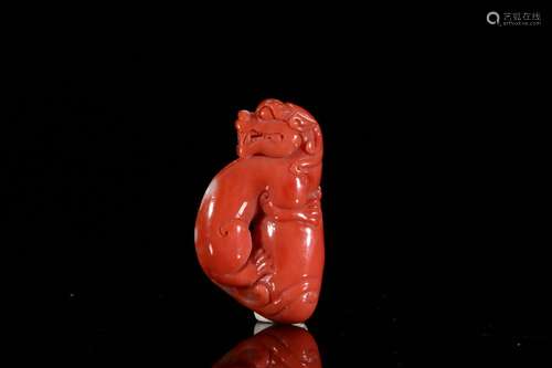 A Chinese Coral Beast Pendant