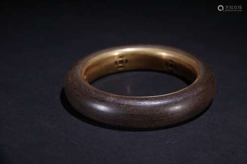 A Chinese Agarwood Gilt Silver Bangle