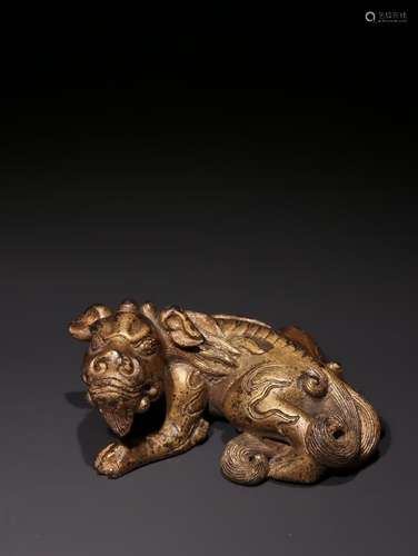 A Chinese Gilt-Lacquered Bronze Beast Paperweight Ornament