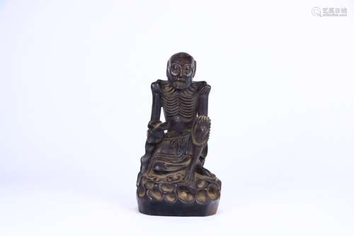 A Chinese Rosewood Skinny Arhat Ornament